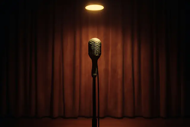 Empty microphone on a stand under a single spotlight in a dim club