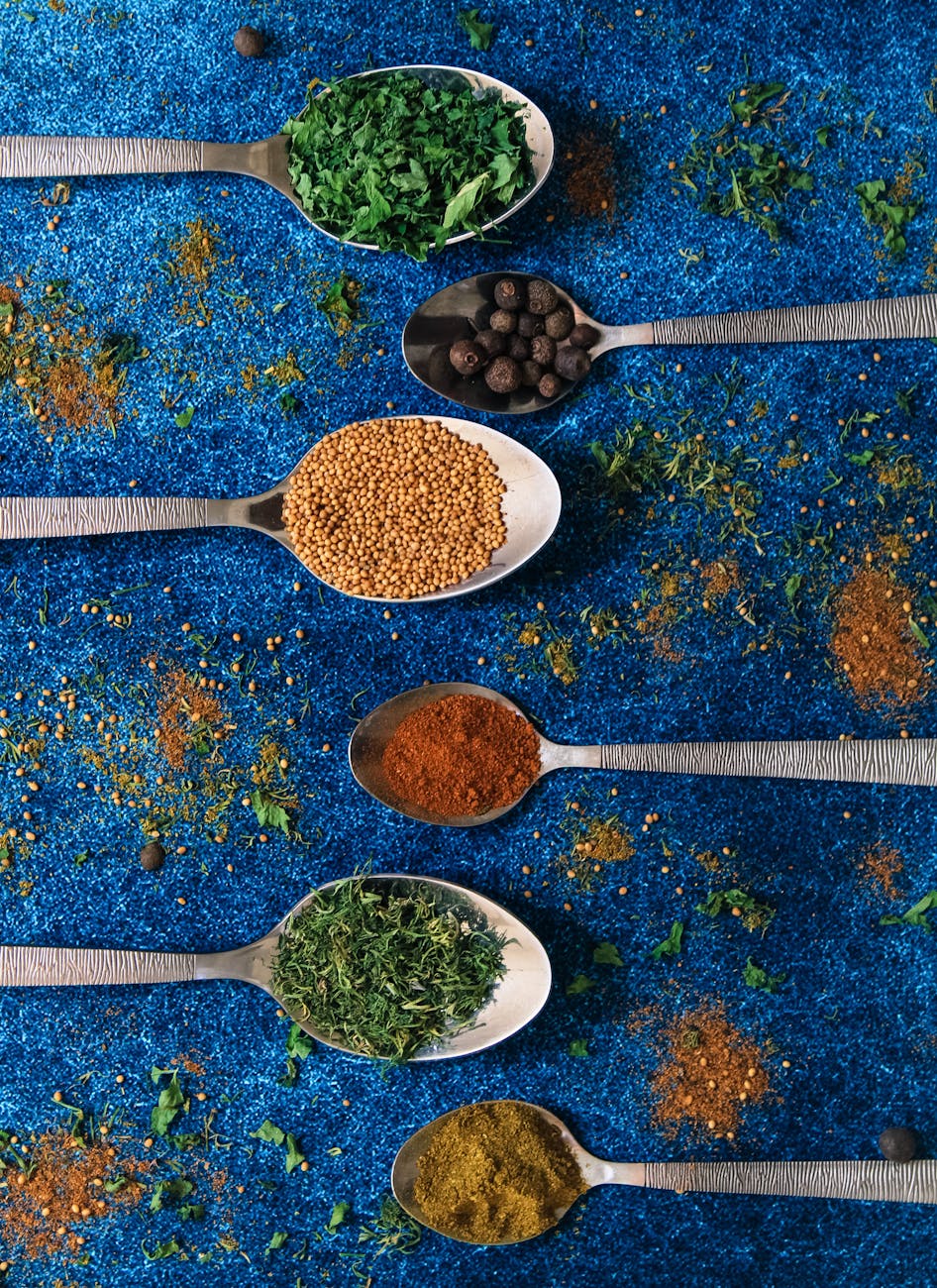 variety of spices on spoons