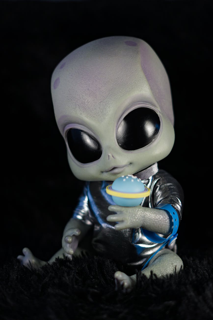 cute alien toy with space theme