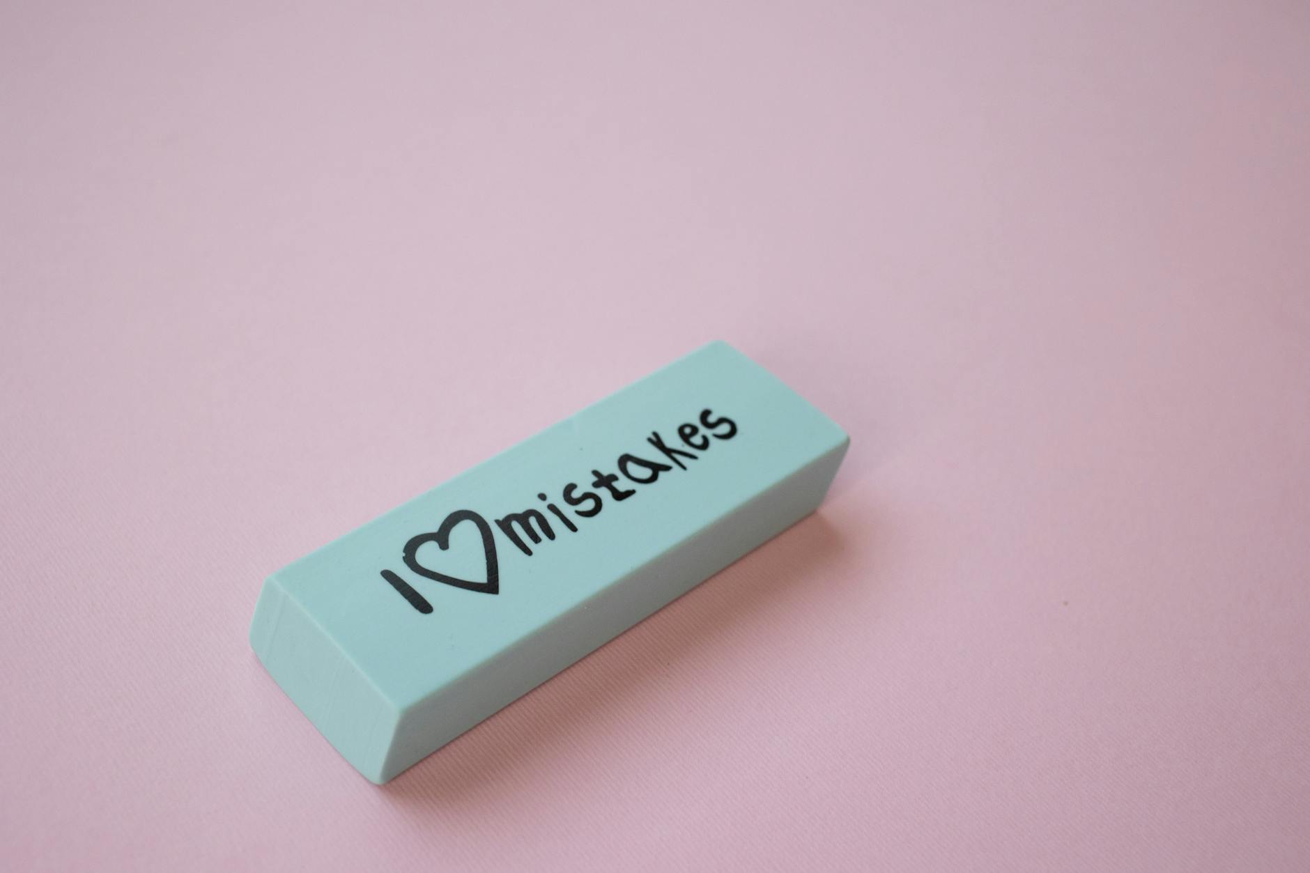 an eraser on a pink surface