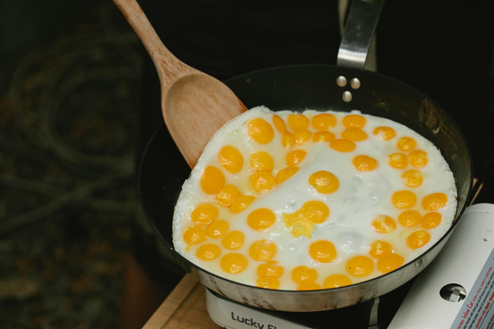 delicious quail eggs frying in pan