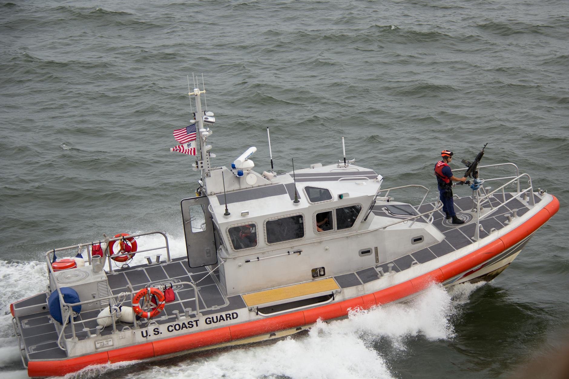 white orange u s coast guard boat on the sea